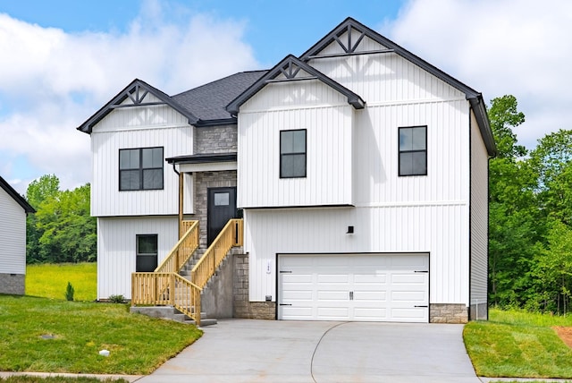 197 Dewberry Ct, Clarksville, TN 37042 - view of front of property featuring concrete driveway, stone siding, a garage, and a front yard