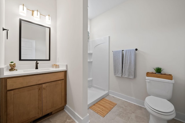 197 Dewberry Ct, Clarksville, TN 37042 - bathroom with vanity, baseboards, toilet, and walk in shower