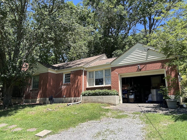 4671 Whites Creek Pike, Whites Creek, TN 37189 - view of front of home featuring gravel driveway, an attached garage, brick siding, and a front yard