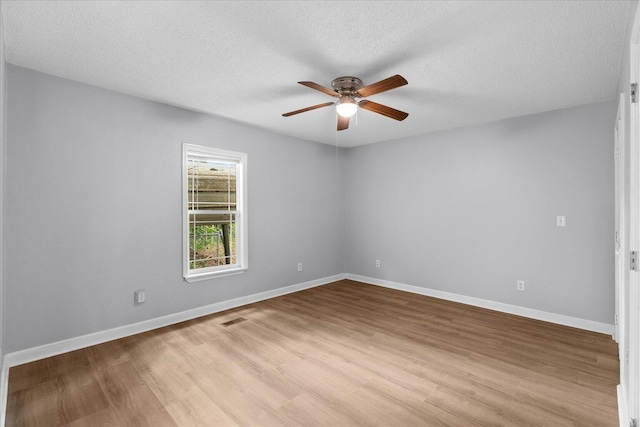 724 Shelly Ln, Rossville, GA 30741 - spare room featuring a ceiling fan, light wood-style floors, and a textured ceiling