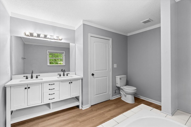 724 Shelly Ln, Rossville, GA 30741 - bathroom with double vanity, wood finished floors, a textured ceiling, and a tub to relax in
