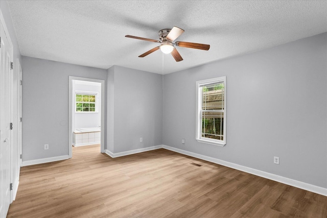 724 Shelly Ln, Rossville, GA 30741 - unfurnished room featuring light wood-style flooring, a ceiling fan, and a textured ceiling