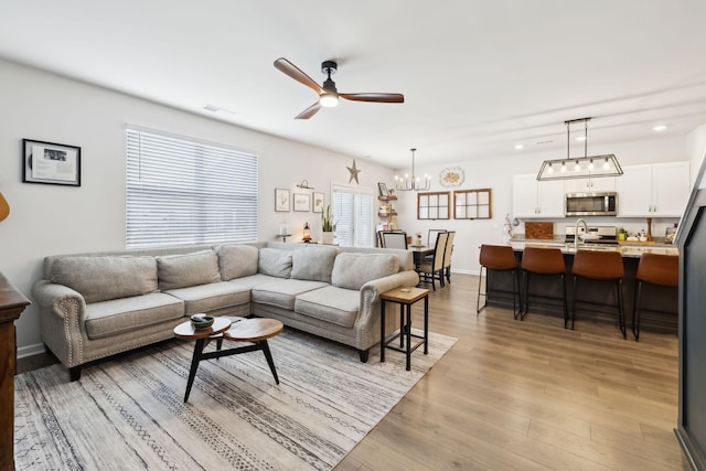 1006 Pepper Stone Dr, Lebanon, TN 37087 - living area with ceiling fan, light wood-type flooring, a chandelier, recessed lighting, and baseboards