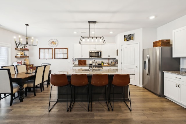 1006 Pepper Stone Dr, Lebanon, TN 37087 - kitchen featuring stainless steel appliances, a sink, dark wood finished floors, a chandelier, and recessed lighting