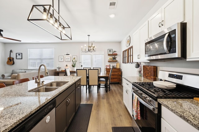 1006 Pepper Stone Dr, Lebanon, TN 37087 - kitchen featuring stainless steel appliances, a sink, a chandelier, and healthy amount of natural light