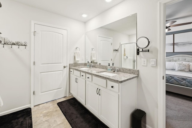 1006 Pepper Stone Dr, Lebanon, TN 37087 - ensuite bathroom featuring double vanity, a stall shower, ceiling fan, and baseboards