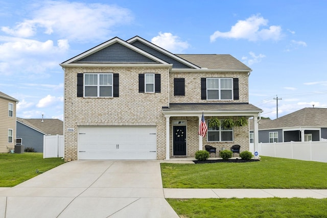 1006 Pepper Stone Dr, Lebanon, TN 37087 - view of front facade featuring a garage, concrete driveway, brick siding, and a porch