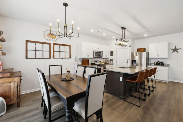 1006 Pepper Stone Dr, Lebanon, TN 37087 - dining room with a chandelier, recessed lighting, dark wood-style flooring, and baseboards