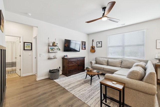 1006 Pepper Stone Dr, Lebanon, TN 37087 - living room with ceiling fan, light wood-style floors, and baseboards