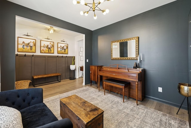 1006 Pepper Stone Dr, Lebanon, TN 37087 - living area featuring wood finished floors, a chandelier, and baseboards