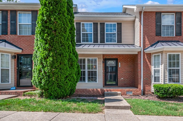 7204 Rosemary Ct, Fairview, TN 37062 - view of front of home featuring a standing seam roof, brick siding, covered porch, and metal roof