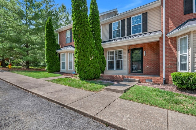 7204 Rosemary Ct, Fairview, TN 37062 - traditional-style home featuring a standing seam roof, brick siding, and a metal roof