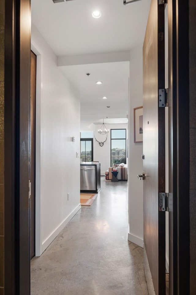 1510 Demonbreun St Unit 701, Nashville, TN 37203 - corridor with baseboards, concrete flooring, and recessed lighting