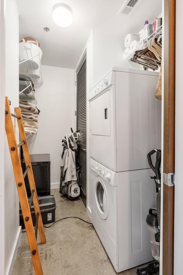 1510 Demonbreun St Unit 701, Nashville, TN 37203 - laundry area with stacked washer / dryer and baseboards