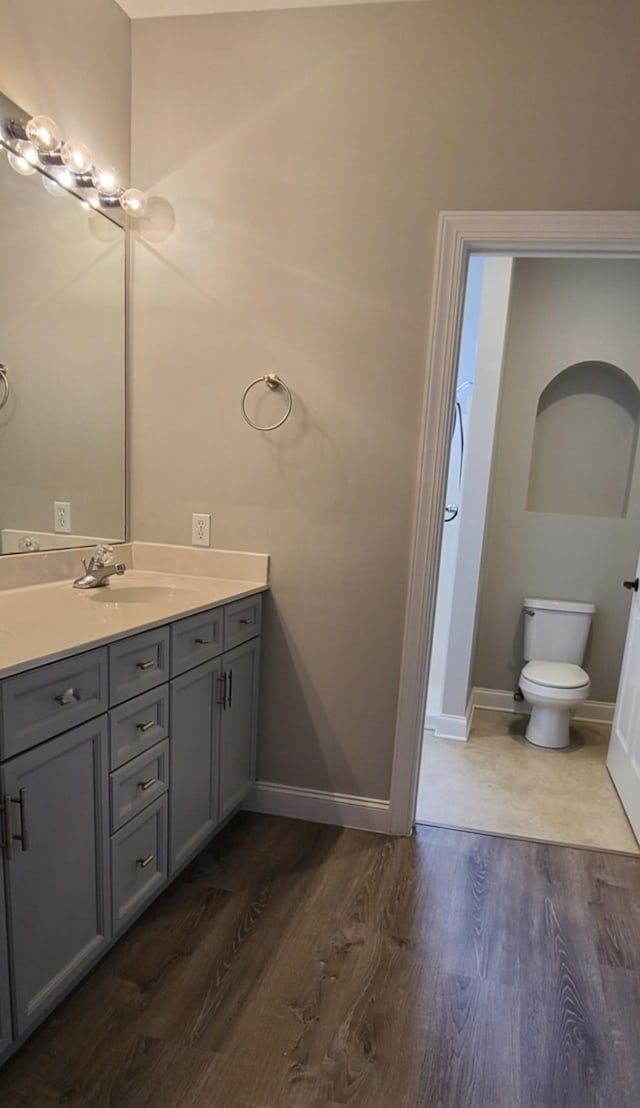4316 Summercrest Blvd Unit 519, Antioch, TN 37013 - bathroom with wood finished floors, vanity, toilet, and baseboards