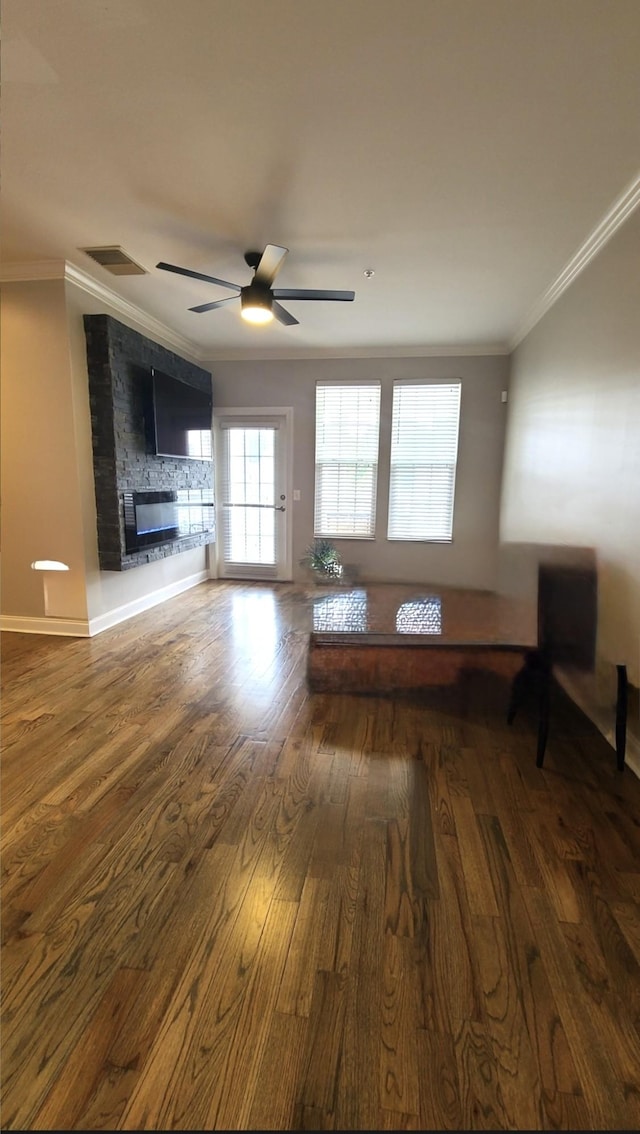 4316 Summercrest Blvd Unit 519, Antioch, TN 37013 - living area with crown molding, wood finished floors, a ceiling fan, a fireplace, and baseboards