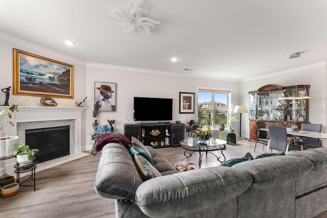 134 Wynfield Blvd, Mount Juliet, TN 37122 - living room with crown molding, light wood-style floors, recessed lighting, a high end fireplace, and baseboards