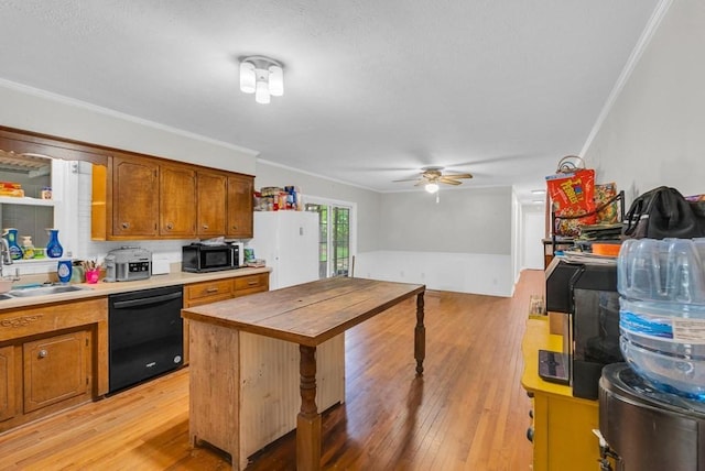 3071 Bayshore Dr, Cookeville, TN 38506 - kitchen with black appliances, ornamental molding, light wood-style flooring, a ceiling fan, and brown cabinets