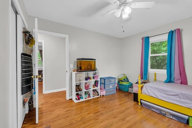 3071 Bayshore Dr, Cookeville, TN 38506 - bedroom featuring wood finished floors, baseboards, ceiling fan, and a closet