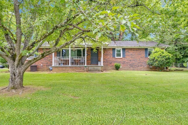 3071 Bayshore Dr, Cookeville, TN 38506 - view of front of property with a front yard, brick siding, and covered porch