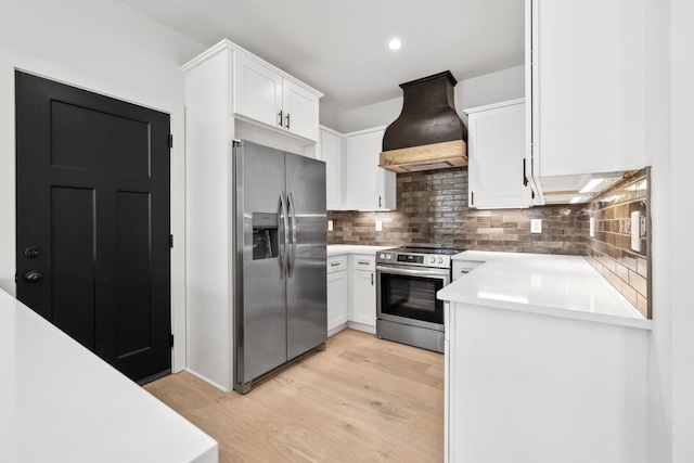 827 Oconner St, Smithville, TN 37166 - kitchen featuring appliances with stainless steel finishes, custom range hood, white cabinets, backsplash, and light countertops