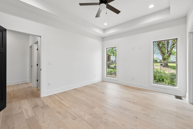 827 Oconner St, Smithville, TN 37166 - unfurnished room featuring light wood-style floors, ceiling fan, a raised ceiling, baseboards, and recessed lighting