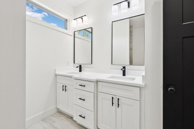 827 Oconner St, Smithville, TN 37166 - bathroom featuring marble look tiles, double vanity, and baseboards