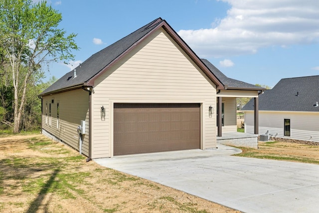 827 Oconner St, Smithville, TN 37166 - view of front facade with cooling unit, driveway, and a garage