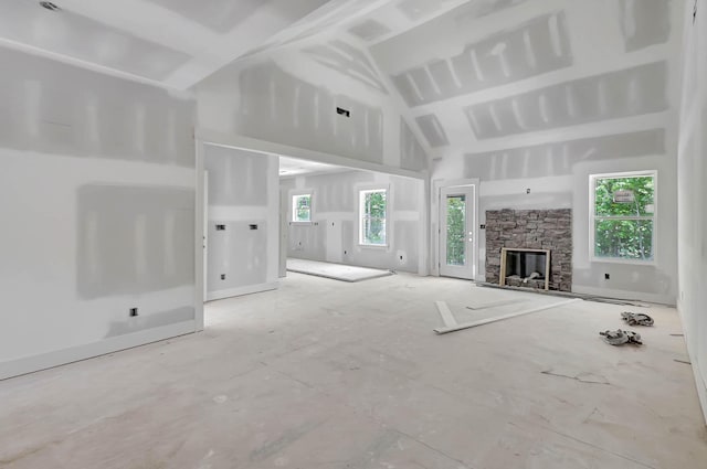 12165 Bull Run Lot # 159, Birchwood, TN 37308 - unfurnished living room with healthy amount of natural light, a stone fireplace, and high vaulted ceiling