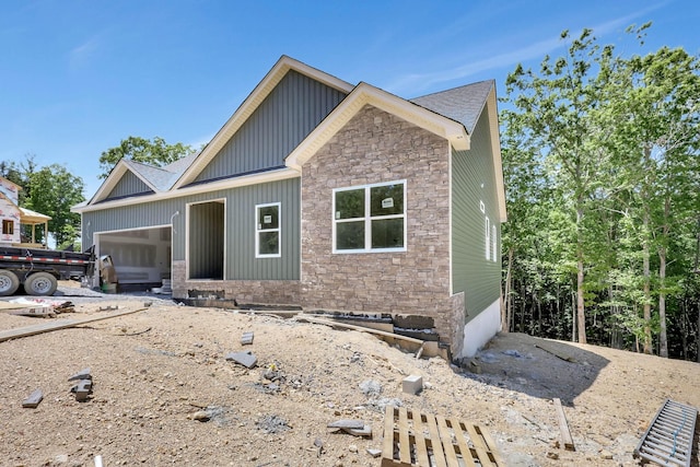 12165 Bull Run Lot # 159, Birchwood, TN 37308 - view of front facade featuring stone siding, an attached garage, and board and batten siding