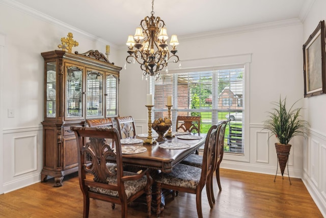 5405 Cliffstone Dr, Smyrna, TN 37167 - dining area featuring a decorative wall, a chandelier, wood finished floors, crown molding, and a wainscoted wall