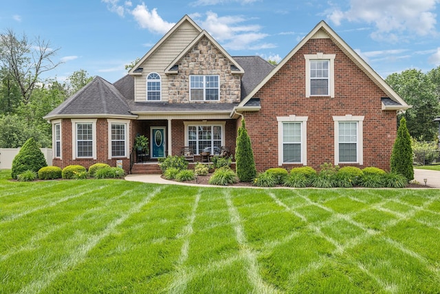 5405 Cliffstone Dr, Smyrna, TN 37167 - view of front of house with a front yard, brick siding, and a shingled roof