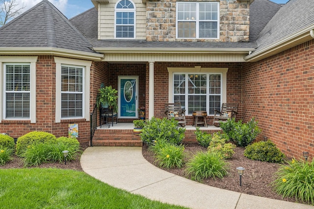 5405 Cliffstone Dr, Smyrna, TN 37167 - entrance to property featuring a shingled roof, brick siding, and covered porch
