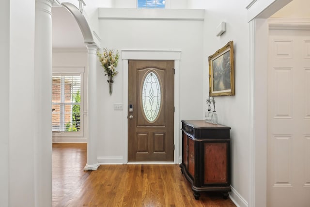 5405 Cliffstone Dr, Smyrna, TN 37167 - entrance foyer featuring decorative columns, wood finished floors, baseboards, and arched walkways