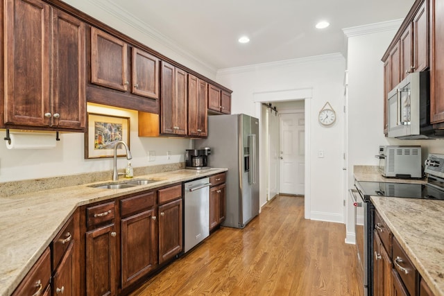 5405 Cliffstone Dr, Smyrna, TN 37167 - kitchen with appliances with stainless steel finishes, a sink, light wood-style floors, ornamental molding, and light stone counters