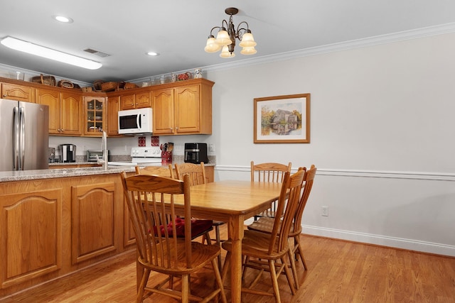 72 Anchor Dr, Rossville, GA 30741 - dining space featuring crown molding, light wood-style flooring, a chandelier, recessed lighting, and baseboards