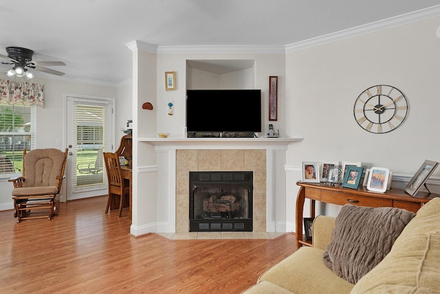 72 Anchor Dr, Rossville, GA 30741 - living area featuring wood finished floors, crown molding, a ceiling fan, and a fireplace