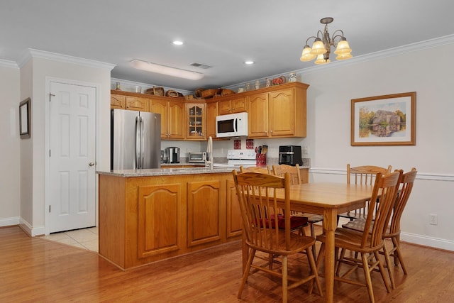 72 Anchor Dr, Rossville, GA 30741 - kitchen with white appliances, ornamental molding, light wood-style flooring, glass insert cabinets, and a chandelier