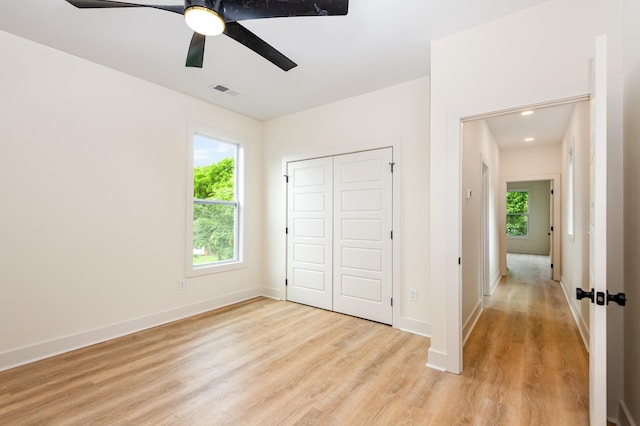 311 N 9th St, Nashville, TN 37206 - unfurnished bedroom featuring light wood-style floors, baseboards, a closet, and a ceiling fan