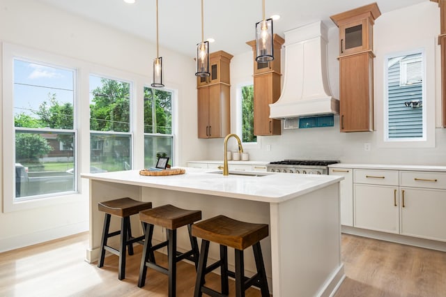 311 N 9th St, Nashville, TN 37206 - kitchen with custom range hood, light wood finished floors, a sink, light countertops, and recessed lighting