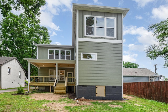 311 N 9th St, Nashville, TN 37206 - rear view of property featuring board and batten siding, a deck, and stairs