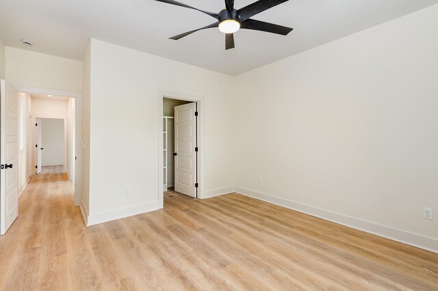 311 N 9th St, Nashville, TN 37206 - unfurnished bedroom with light wood-type flooring, baseboards, a spacious closet, and ceiling fan