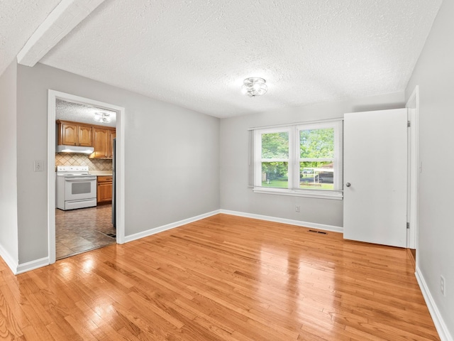 806 Pleasant View Dr, Winchester, TN 37398 - unfurnished room featuring light wood-style floors, a textured ceiling, and baseboards