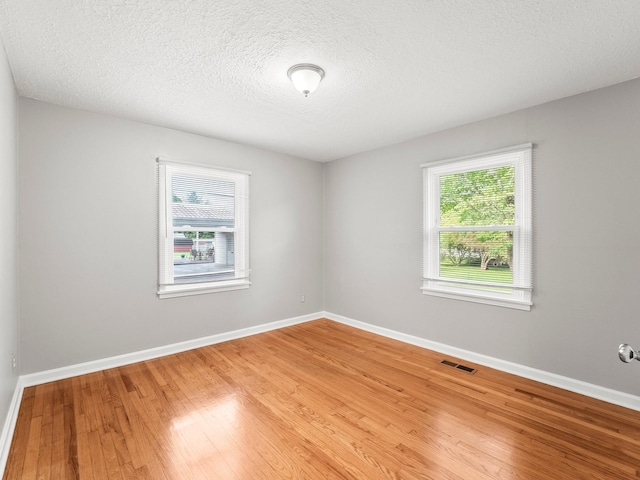 806 Pleasant View Dr, Winchester, TN 37398 - spare room with wood finished floors, baseboards, and a textured ceiling