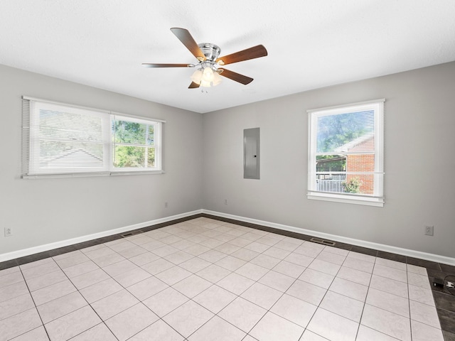 806 Pleasant View Dr, Winchester, TN 37398 - empty room featuring electric panel, a ceiling fan, light tile patterned floors, and baseboards