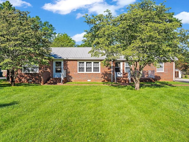 806 Pleasant View Dr, Winchester, TN 37398 - view of front of home with a front yard, brick siding, crawl space, and metal roof