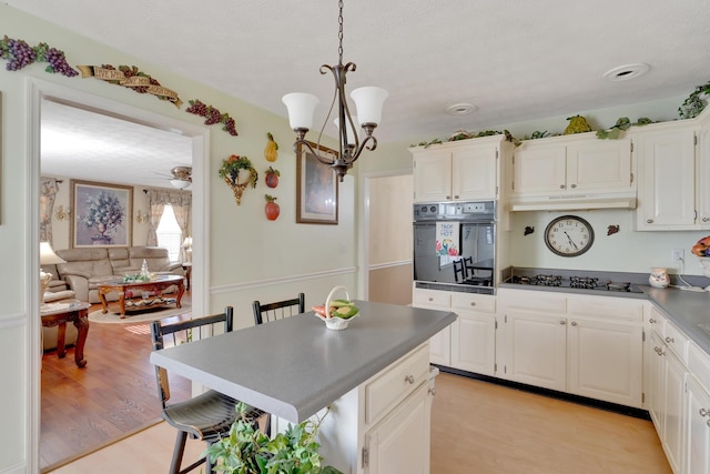 108 Dalewood Cir, Chickamauga, GA 30707 - kitchen with oven, gas stovetop, a chandelier, and white cabinets