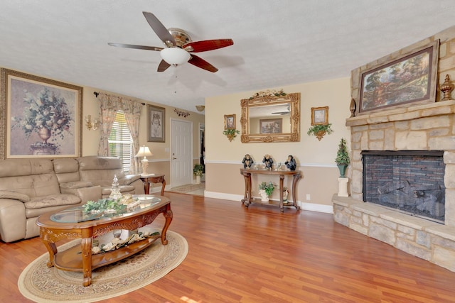 108 Dalewood Cir, Chickamauga, GA 30707 - living room with a ceiling fan, wood finished floors, and a fireplace