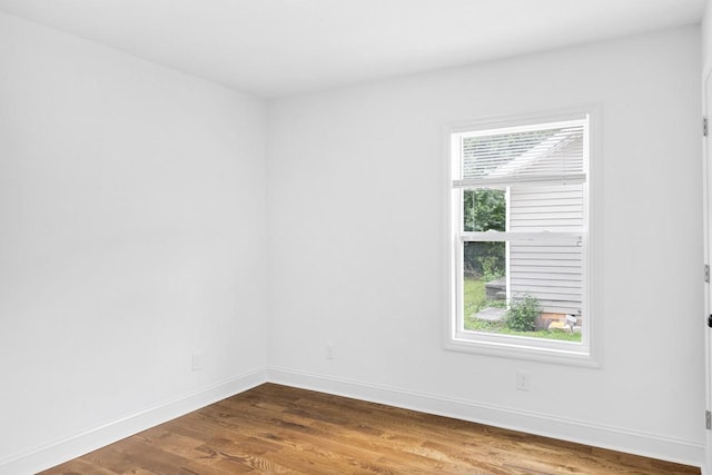 1104 Howell St, Hopkinsville, KY 42240 - spare room with dark wood-style flooring and baseboards