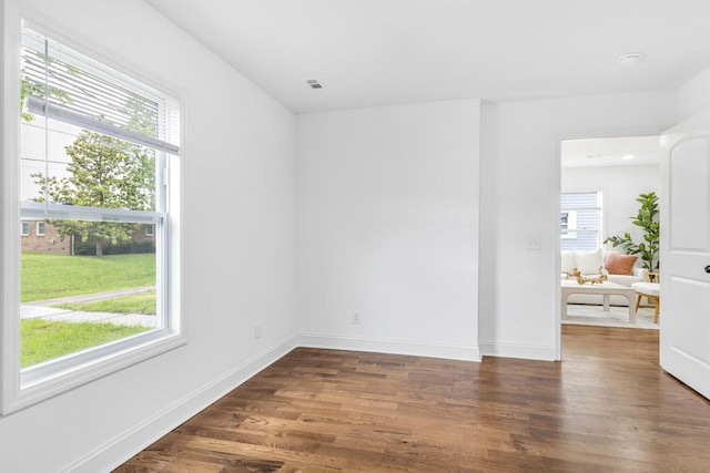 1104 Howell St, Hopkinsville, KY 42240 - spare room with healthy amount of natural light, wood finished floors, and baseboards